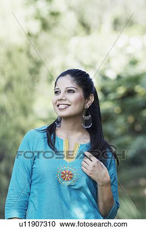 Stock Image - Close-up of a young woman smiling. Fotosearch