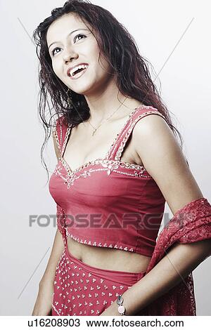 Close-up of a young woman smiling View Large Photo Image Stock Image - Close-up of a young woman smiling. Fotosearch