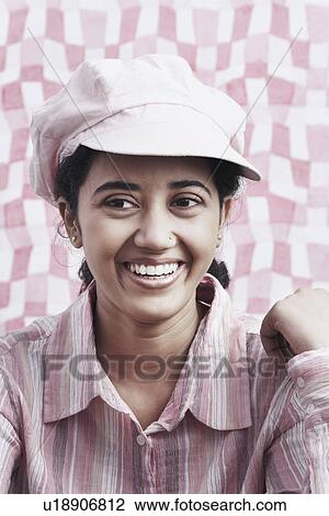 Close-up of a young woman smiling View Large Photo Image Stock Image - Close-up of a young woman smiling. Fotosearch