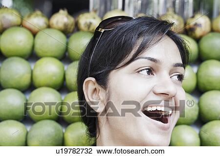 Stock Image - Close-up of a young woman smiling. Fotosearch