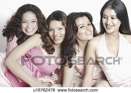 Close-up of four young women smiling View Large Photo Image Stock Photo - Close-up of four young women smiling. Fotosearch