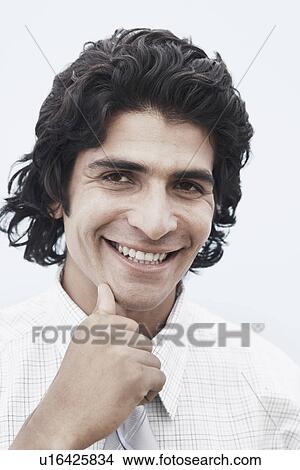 Portrait of a businessman smiling View Large Photo Image Picture - Portrait of a businessman smiling. Fotosearch