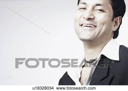 Picture - Portrait of a businessman smiling. Fotosearch