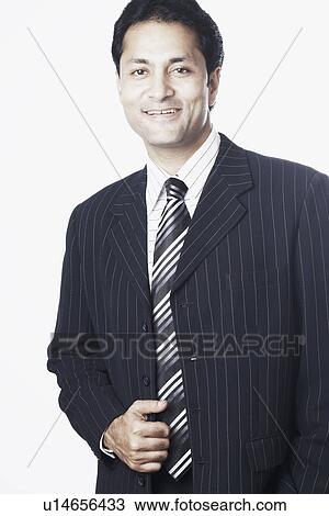 Stock Image - Portrait of a businessman smiling. Fotosearch