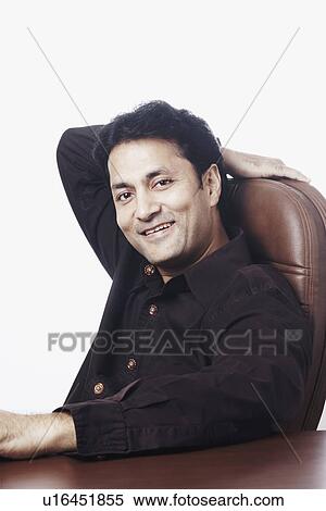 Portrait of a businessman smiling View Large Photo Image Stock Photography - Portrait of a businessman smiling. Fotosearch