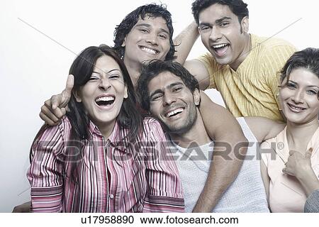 Portrait of a group of young people smiling View Large Photo Image Stock Image - Portrait of a group of young people smiling. Fotosearch