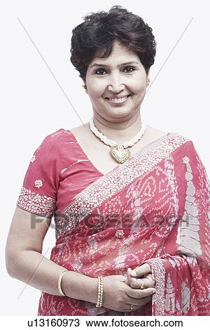 Portrait of a mature woman smiling View Large Photo Image Stock Image - Portrait of a mature woman smiling. Fotosearch