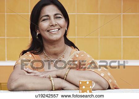 Stock Photo - Portrait of a mature woman smiling. Fotosearch