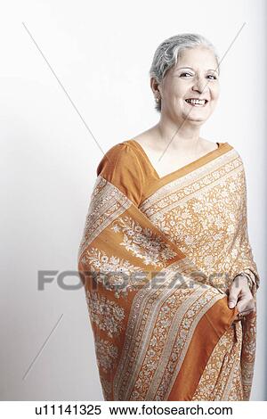 Stock Photography - Portrait of a mature woman smiling. Fotosearch