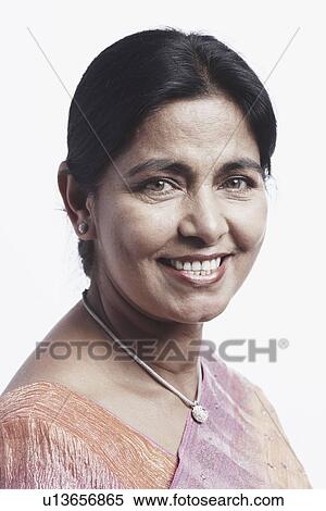 Stock Photography - Portrait of a mature woman smiling. Fotosearch