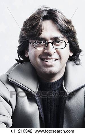 Stock Image - Portrait of a young man smiling. Fotosearch