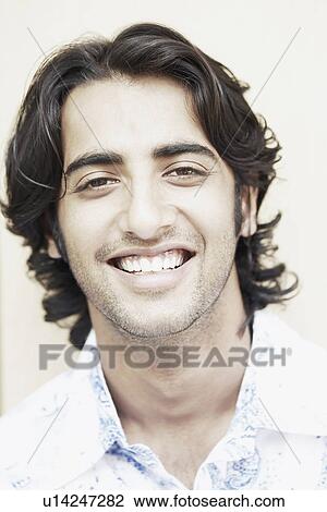 Portrait of a young man smiling View Large Photo Image Stock Image - Portrait of a young man smiling. Fotosearch