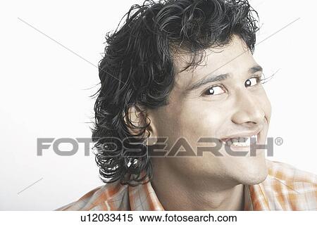 Stock Photography - Portrait of a young man smiling. Fotosearch