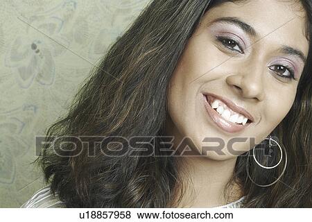 Stock Photo - Portrait of a young woman smiling. Fotosearch