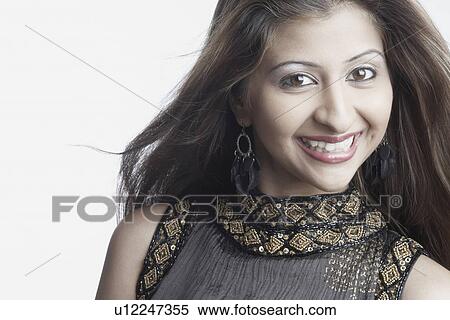 Stock Photography - Portrait of a young woman smiling. Fotosearch