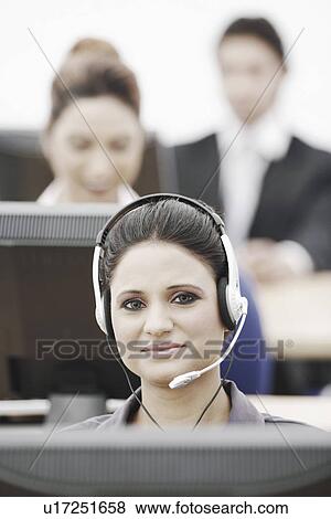 Portrait of a businesswoman wearing a headset View Large Photo Image Stock Photo - Portrait of a businesswoman wearing a headset. Fotosearch