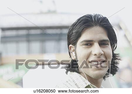 Portrait of a young man smiling View Large Photo Image Stock Image - Portrait of a young man smiling. Fotosearch