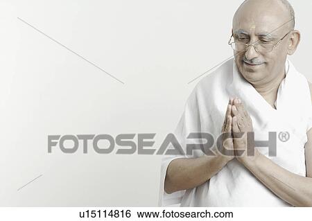 Close-up of a mature man in a prayer position View Large Photo Image Stock Photograph - Close-up of a mature man in a prayer position. Fotosearch