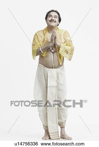 Stock Photograph - Close-up of a priest praying. Fotosearch