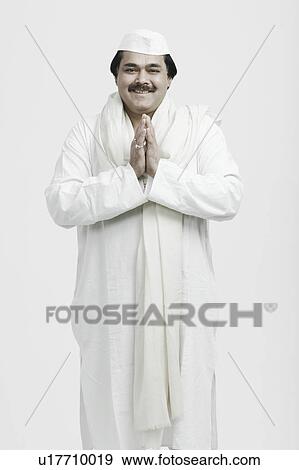 Stock Photo - Portrait of a mature man in a prayer position. Fotosearch