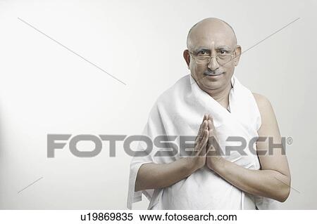 Stock Photography - Portrait of a mature man in a prayer position. Fotosearch