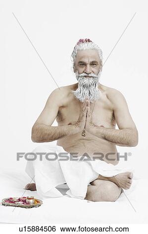 Stock Photograph - Portrait of a priest in a prayer position. Fotosearch