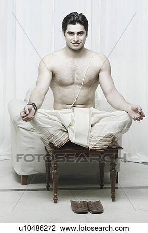 Stock Image - Portrait of a young man meditating. Fotosearch