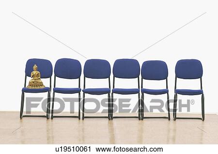 Statue of Buddha on an office chair View Large Photo Image Stock Image - Statue of Buddha on an office chair. Fotosearch