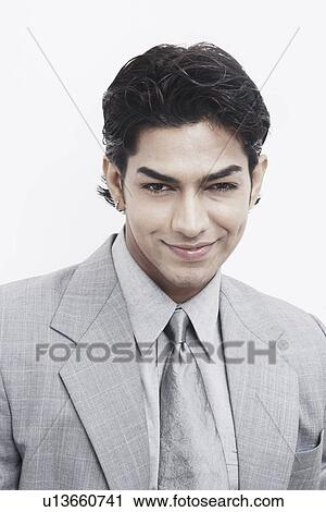 Portrait of a businessman smiling View Large Photo Image Stock Image - Portrait of a businessman smiling. Fotosearch