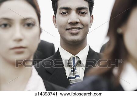 Portrait of a businessman smiling View Large Photo Image Stock Image - Portrait of a businessman smiling. Fotosearch