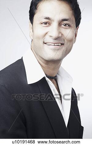 Stock Photo - Portrait of a businessman smiling. Fotosearch