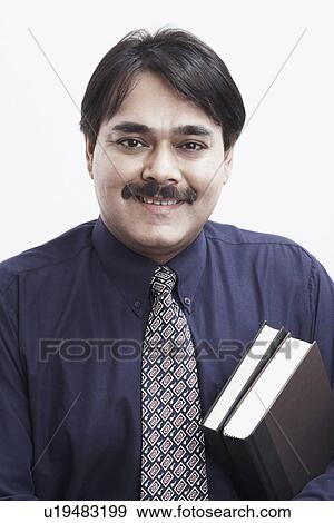 Portrait of a businessman smiling View Large Photo Image Stock Photo - Portrait of a businessman smiling. Fotosearch