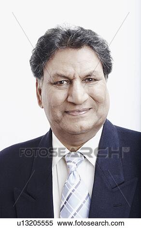 Portrait of a businessman smiling View Large Photo Image Stock Photography - Portrait of a businessman smiling. Fotosearch
