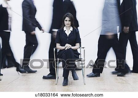 Picture - Portrait of a businesswoman sitting on a chair. Fotosearch