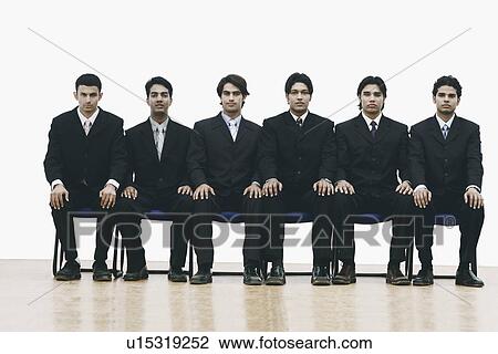 Portrait of a group of young men sitting on chairs View Large Photo Image Stock Image - Portrait of a group of young men sitting on chairs. Fotosearch