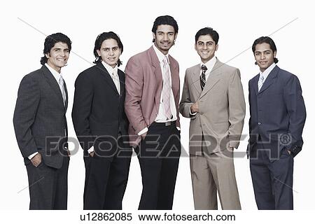 Portrait of five businessmen standing with their hands in their pockets View Large Photo Image Stock Photography - Portrait of five businessmen standing with their hands in their pockets. Fotosearch