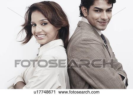 Side profile of a businessman and a businesswoman back to back View Large Photo Image Stock Image - Side profile of a businessman and a businesswoman back to back. Fotosearch