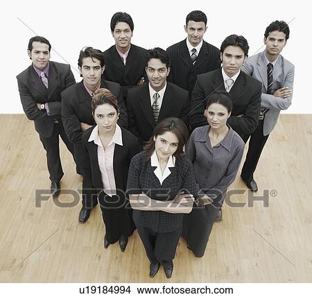 Picture - High angle view of a group of business executives forming a triangle. Fotosearch
