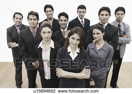 Stock Image - Portrait of a group of business executives standing together. Fotosearch
