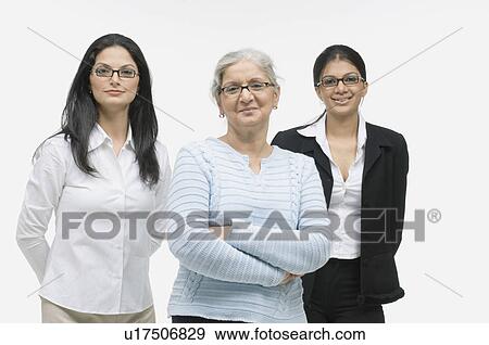Stock Photo - Portrait of three businesswomen smiling. Fotosearch