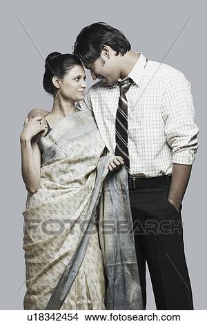 Picture - Close-up of a young couple looking at each other. Fotosearch