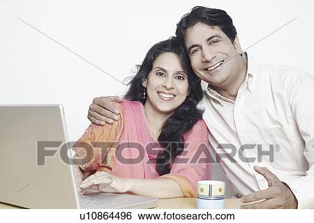 Portrait of a couple smiling View Large Photo Image Stock Photograph - Portrait of a couple smiling. Fotosearch