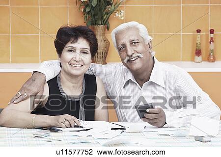 Portrait of a mature couple smiling View Large Photo Image Stock Image - Portrait of a mature couple smiling. Fotosearch