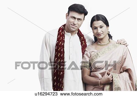 Portrait of a mid adult couple smiling View Large Photo Image Stock Image - Portrait of a mid adult couple smiling. Fotosearch