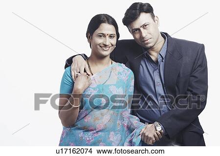 Portrait of a mid adult couple standing holding hands View Large Photo Image Picture - Portrait of a mid adult couple standing holding hands. Fotosearch