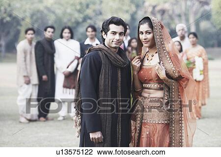 Stock Image - Portrait of a newlywed couple smiling. Fotosearch