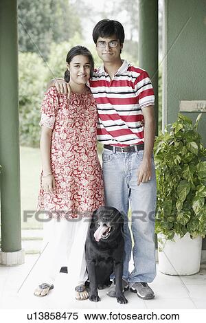 Portrait of a young couple and their dog View Large Photo Image Stock Photography - Portrait of a young couple and their dog. Fotosearch