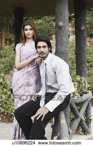 Picture - Portrait of a young couple in the garden. Fotosearch