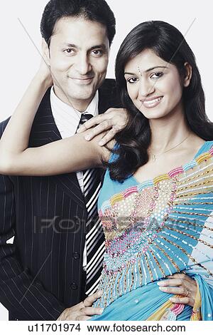 Portrait of a young couple smiling View Large Photo Image Picture - Portrait of a young couple smiling. Fotosearch