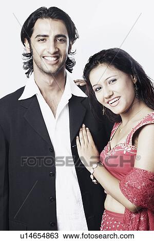 Portrait of a young couple smiling View Large Photo Image Stock Image - Portrait of a young couple smiling. Fotosearch